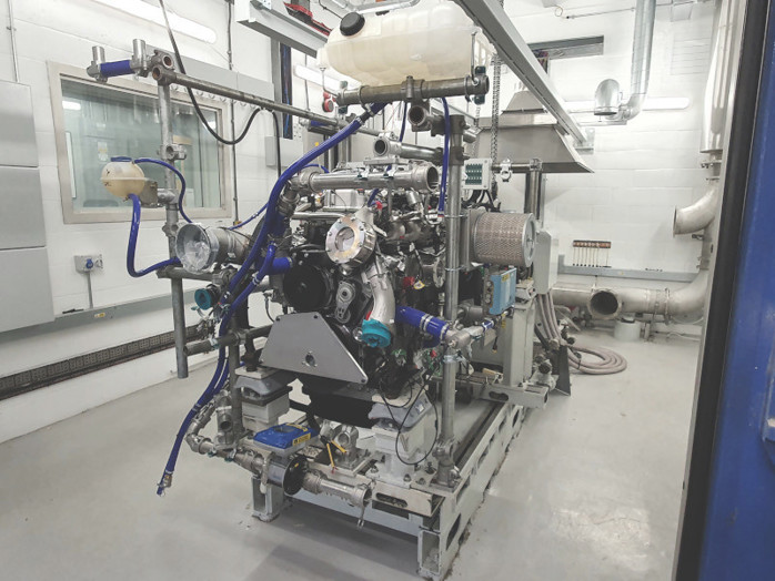 A perspective view of a hydrogen combustion engine on a test rig at Ricardo connected to cooling and hydrogen ancillaries