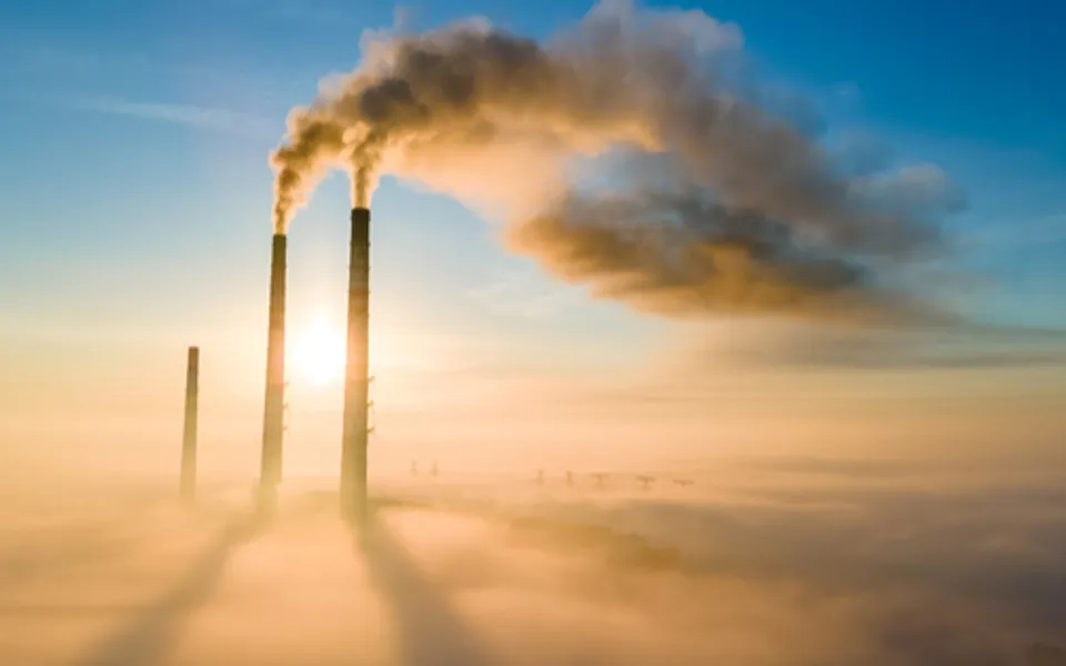 Smoking Chimney Above Clouds