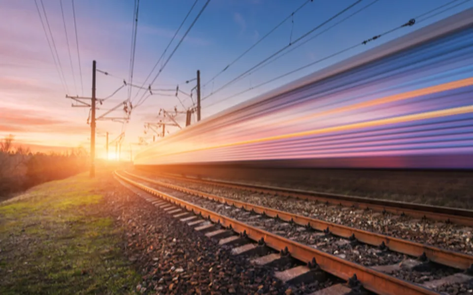 Train In Motion Beside Train Track